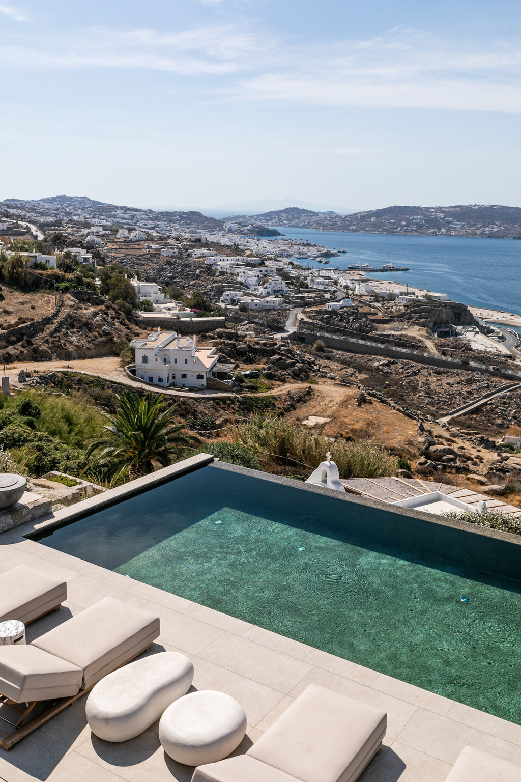 Pool with scenic view of a coastal town and sea