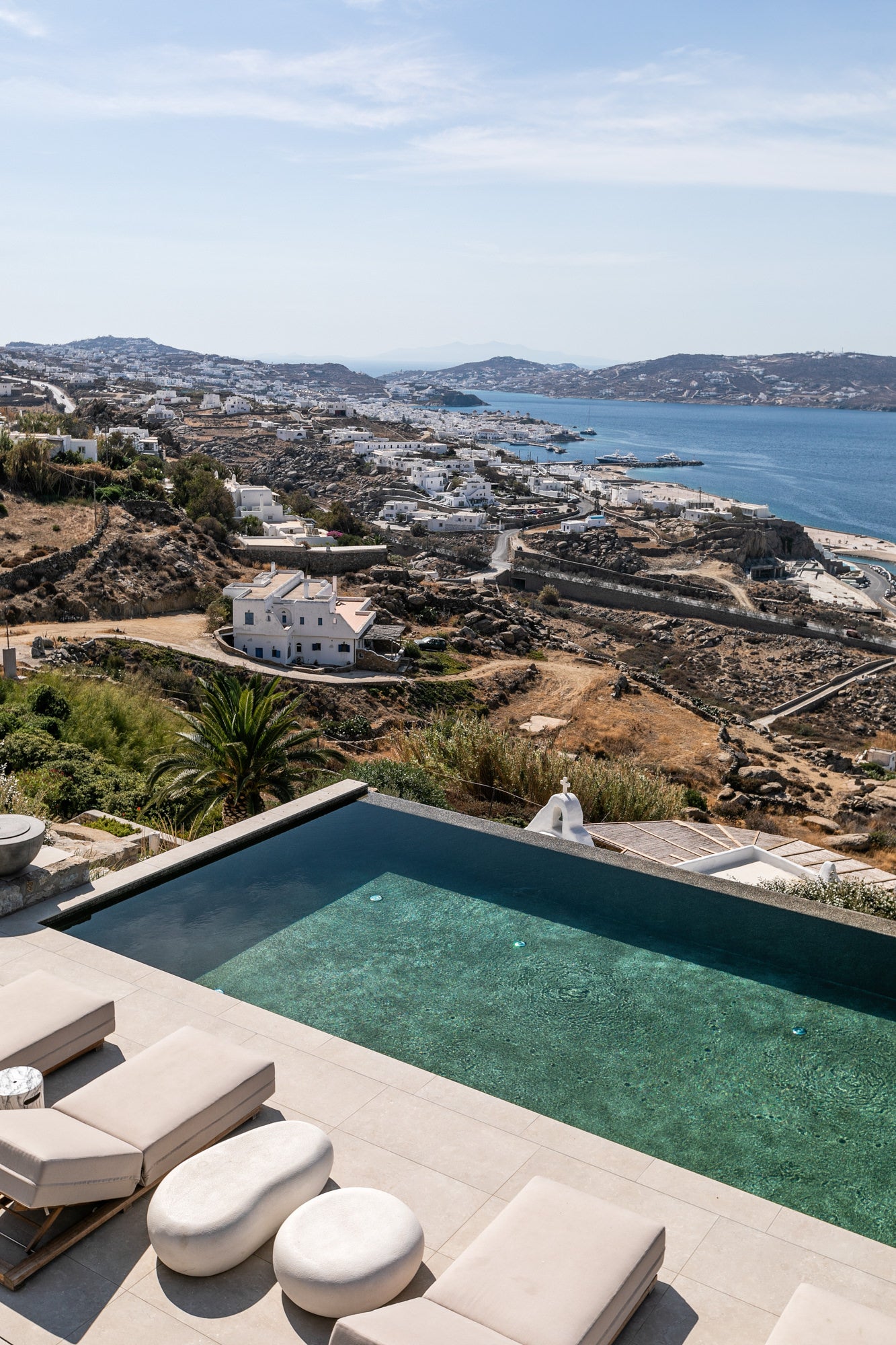 Pool with scenic view of a coastal town and sea