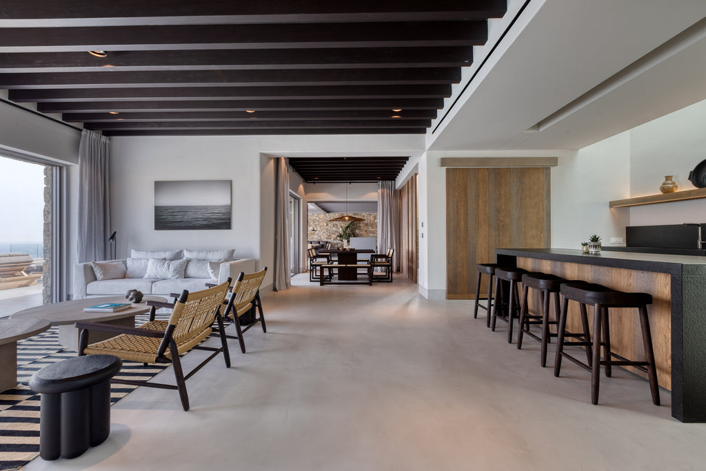 Modern living room with a bar area and scenic view