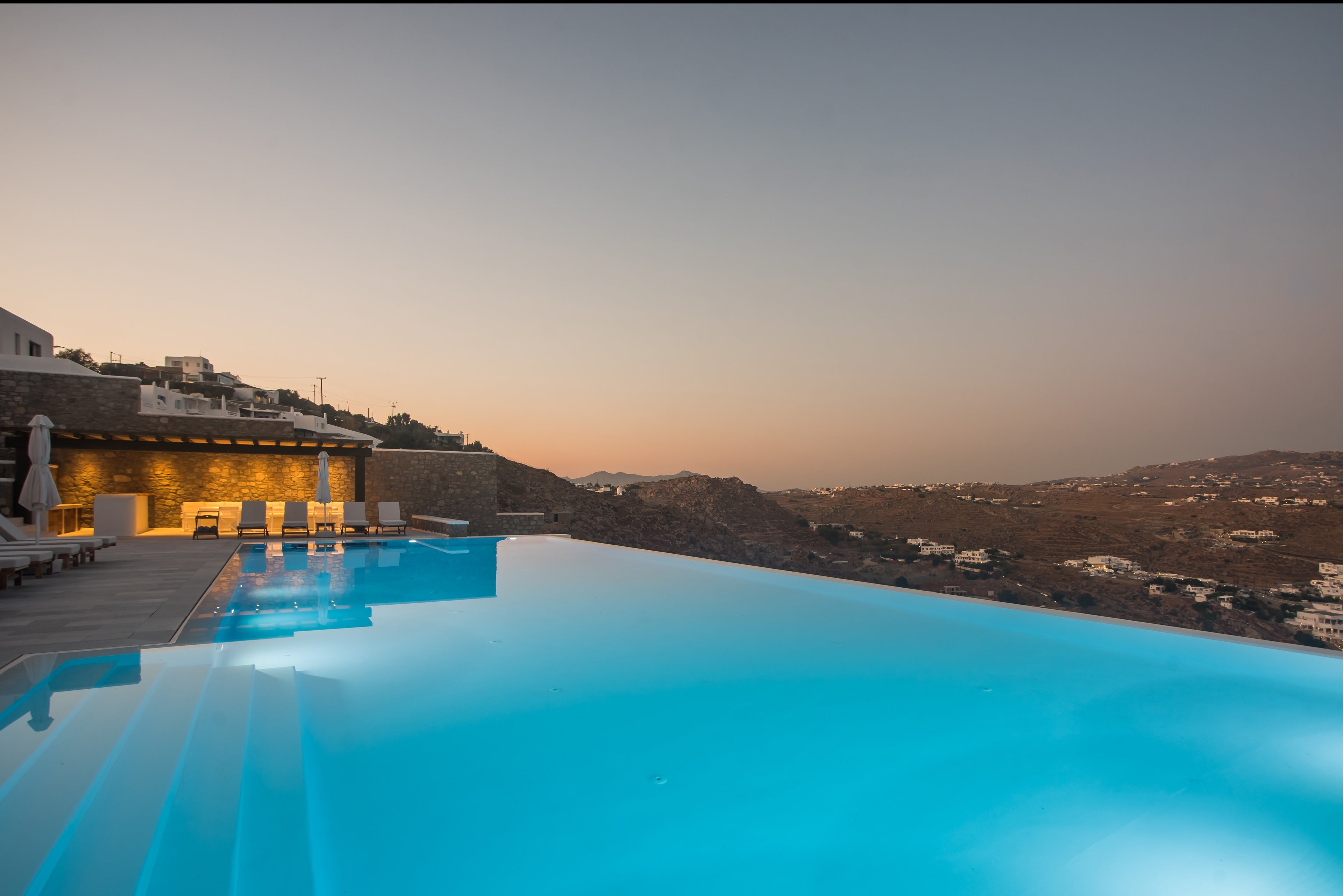 Infinity pool with scenic view at dusk