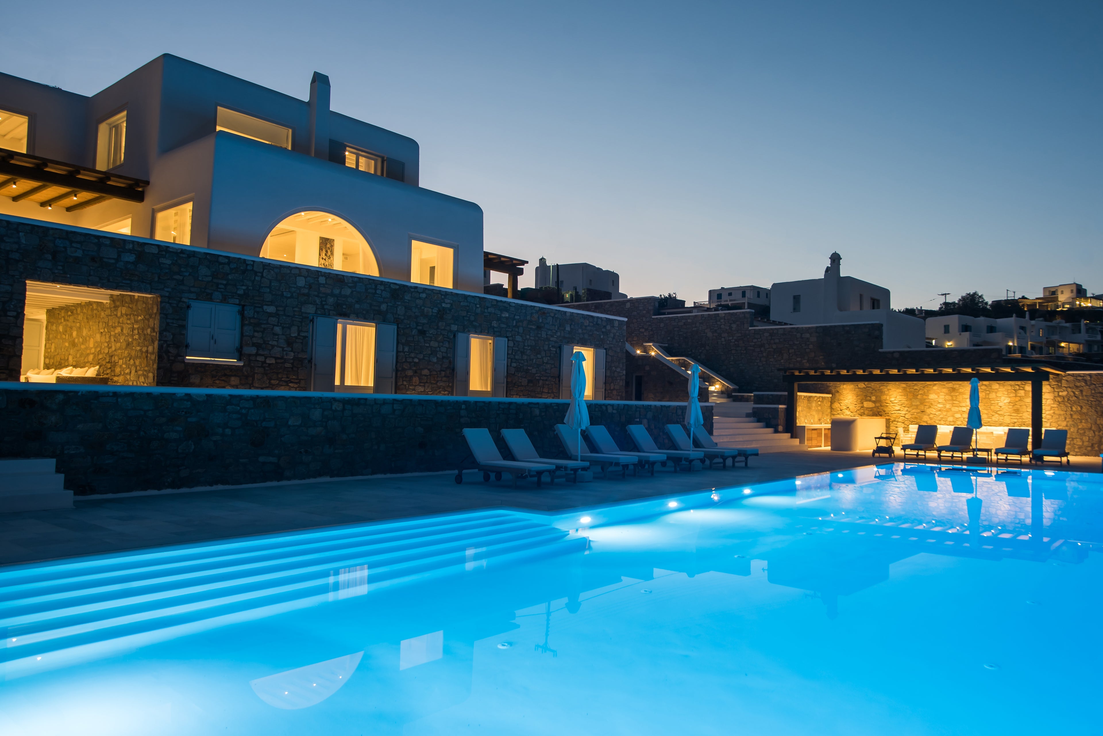 Pool area with modern building at night
