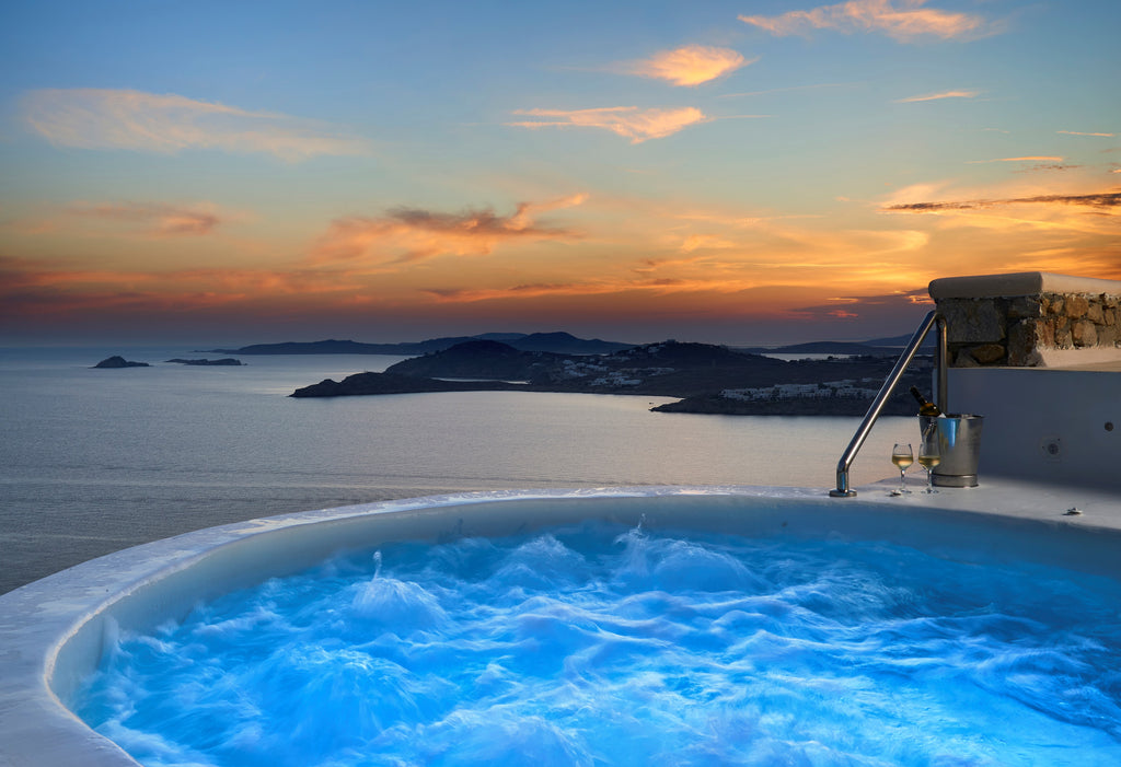 Hot tub with ocean view during sunset