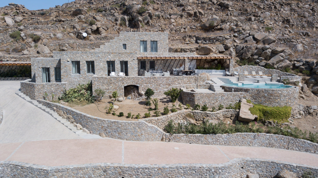 Stone villa with pool on a hillside in a mountainous area