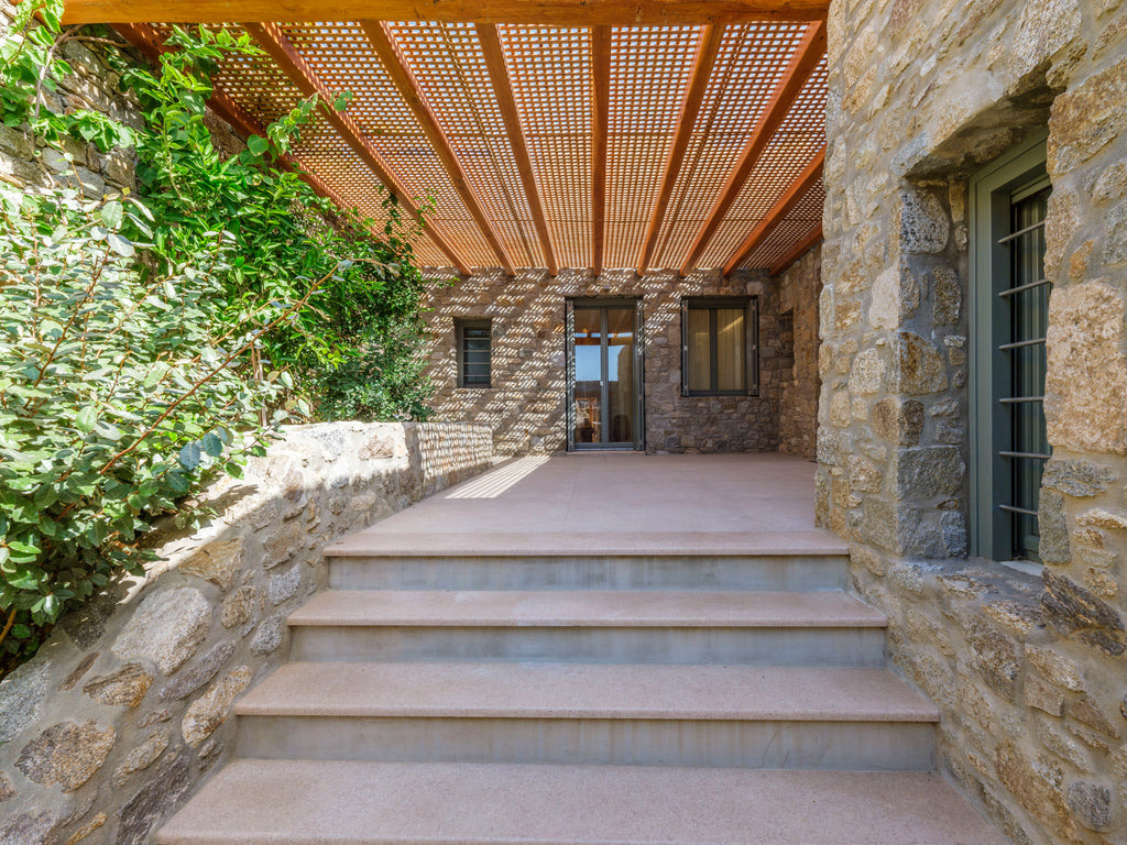 Stairway leading to a stone building with a modern design