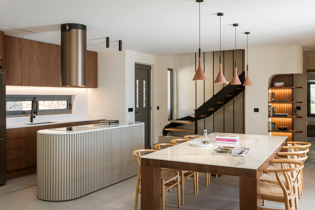 Modern kitchen with island and dining table