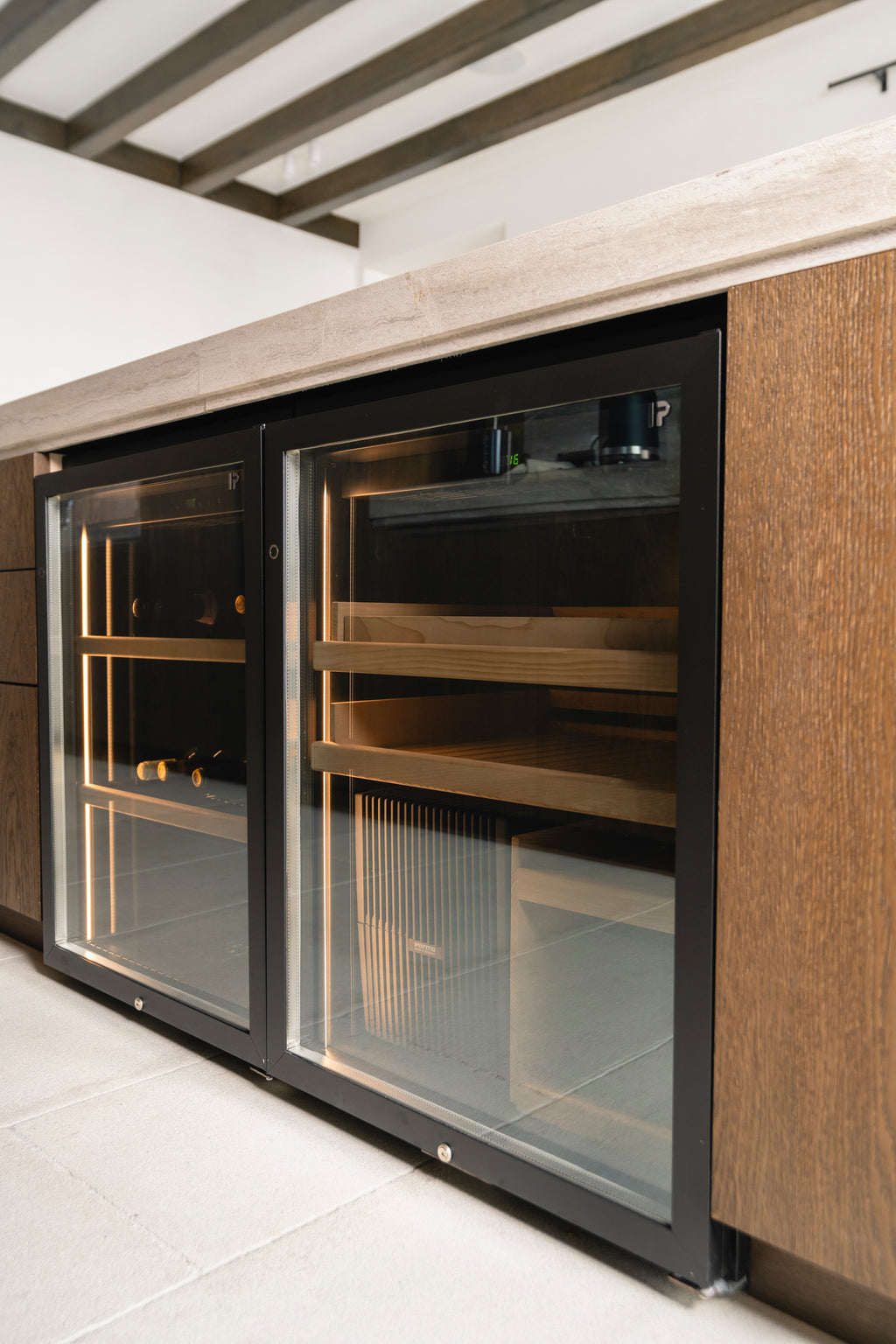 Modern kitchen with wooden cabinets and built-in wine cooler.