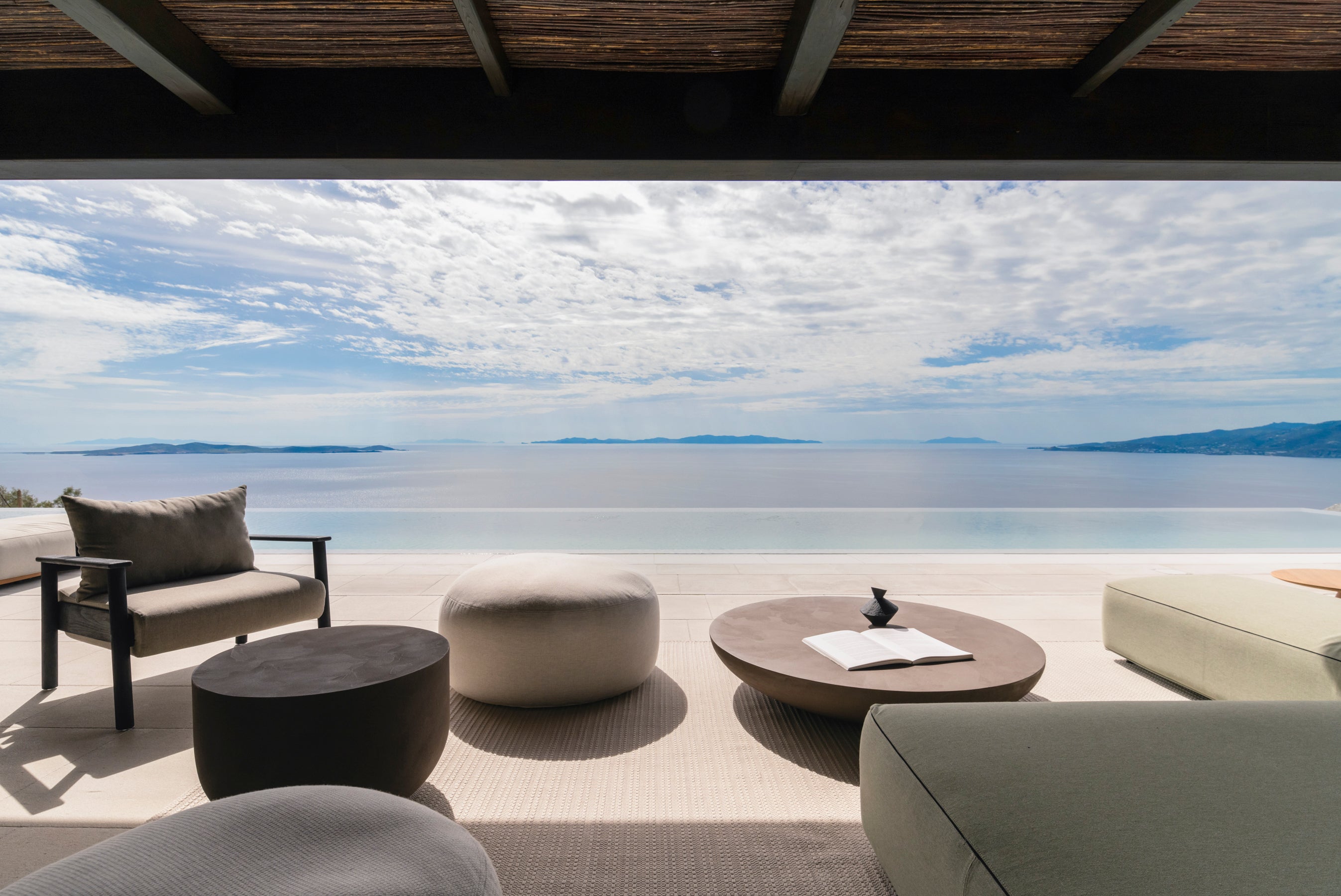Modern outdoor furniture set with a scenic ocean view
