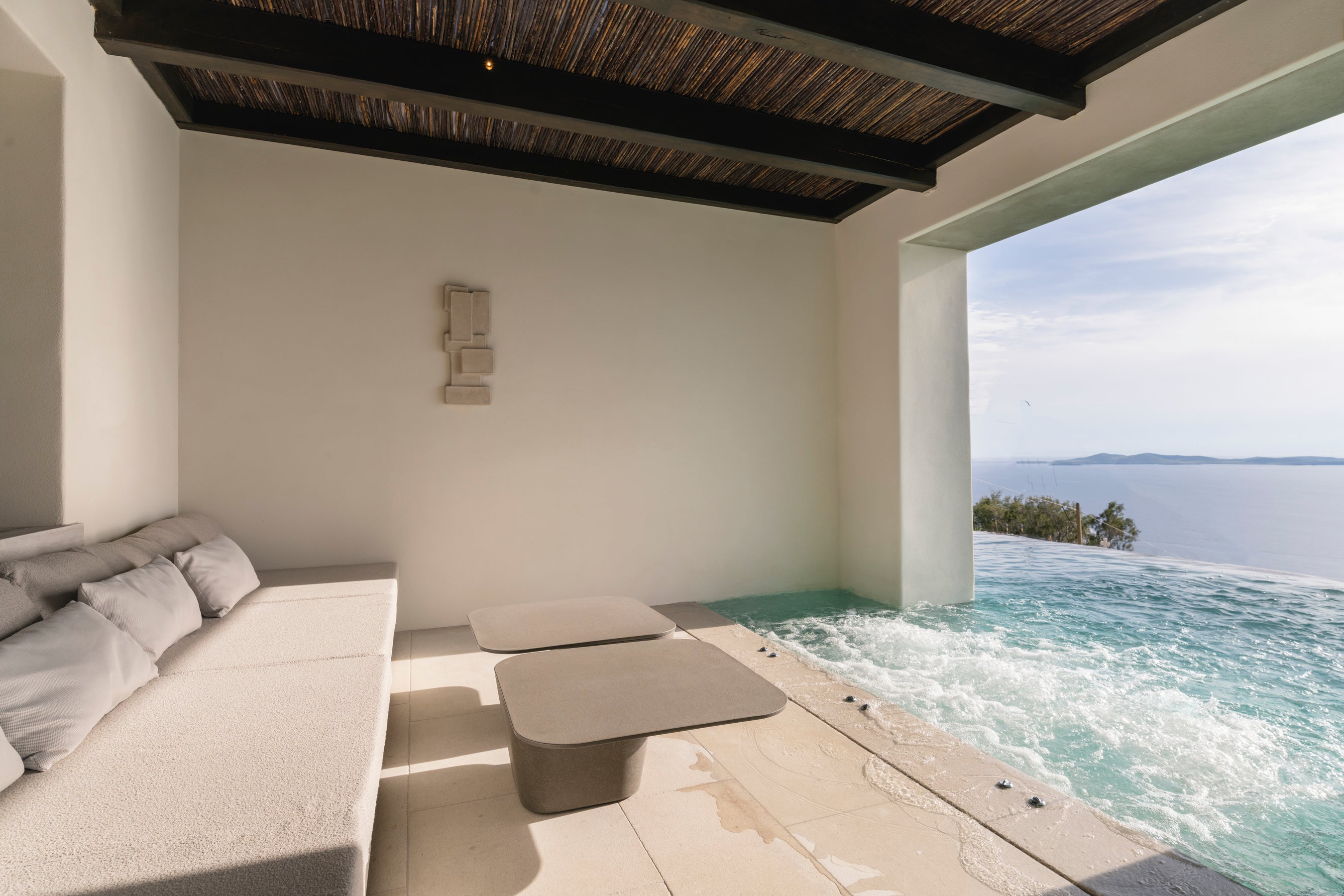Modern outdoor lounge area with a view of the ocean