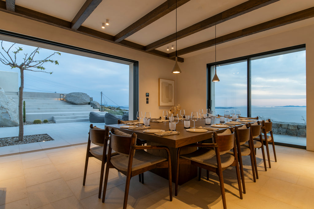 Dining area with large windows overlooking a scenic view