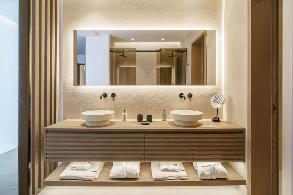 Modern bathroom with double sink vanity and illuminated mirror